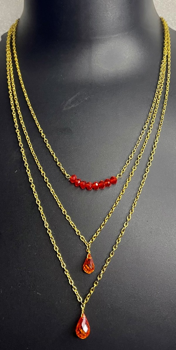 Gold chain necklace with orange beads