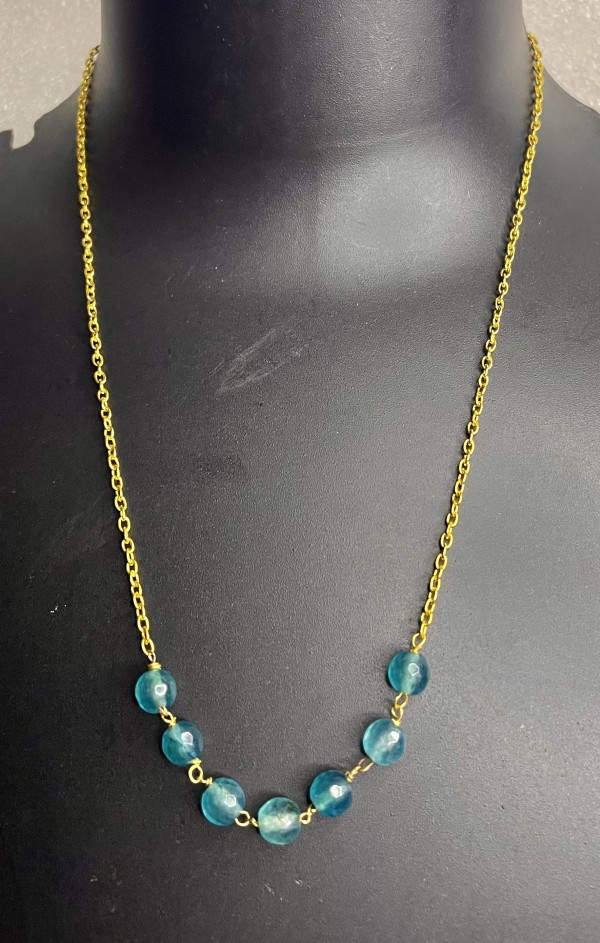 Gold chain necklace with blue beads